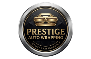 Circular luxury automotive badge logo for Prestige Auto Wrapping featuring a gold 3D muscle car icon and platinum outer ring on a black geometric background.